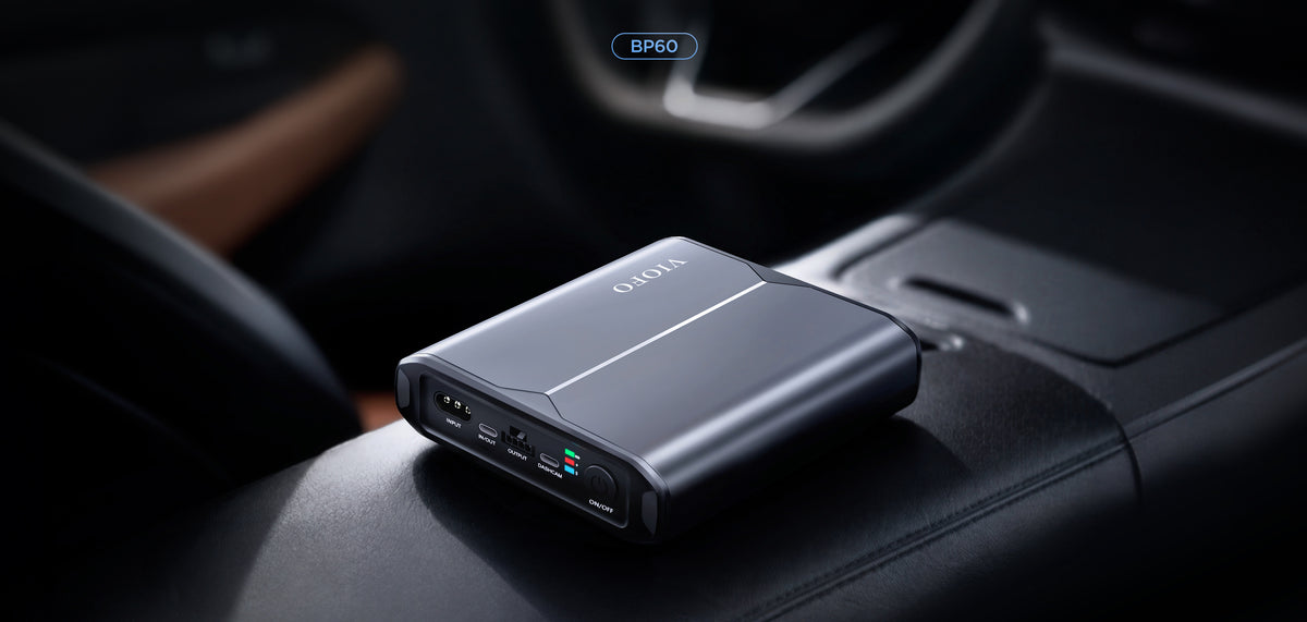 VIOFO BP60 dash cam battery pack resting on a car centre console