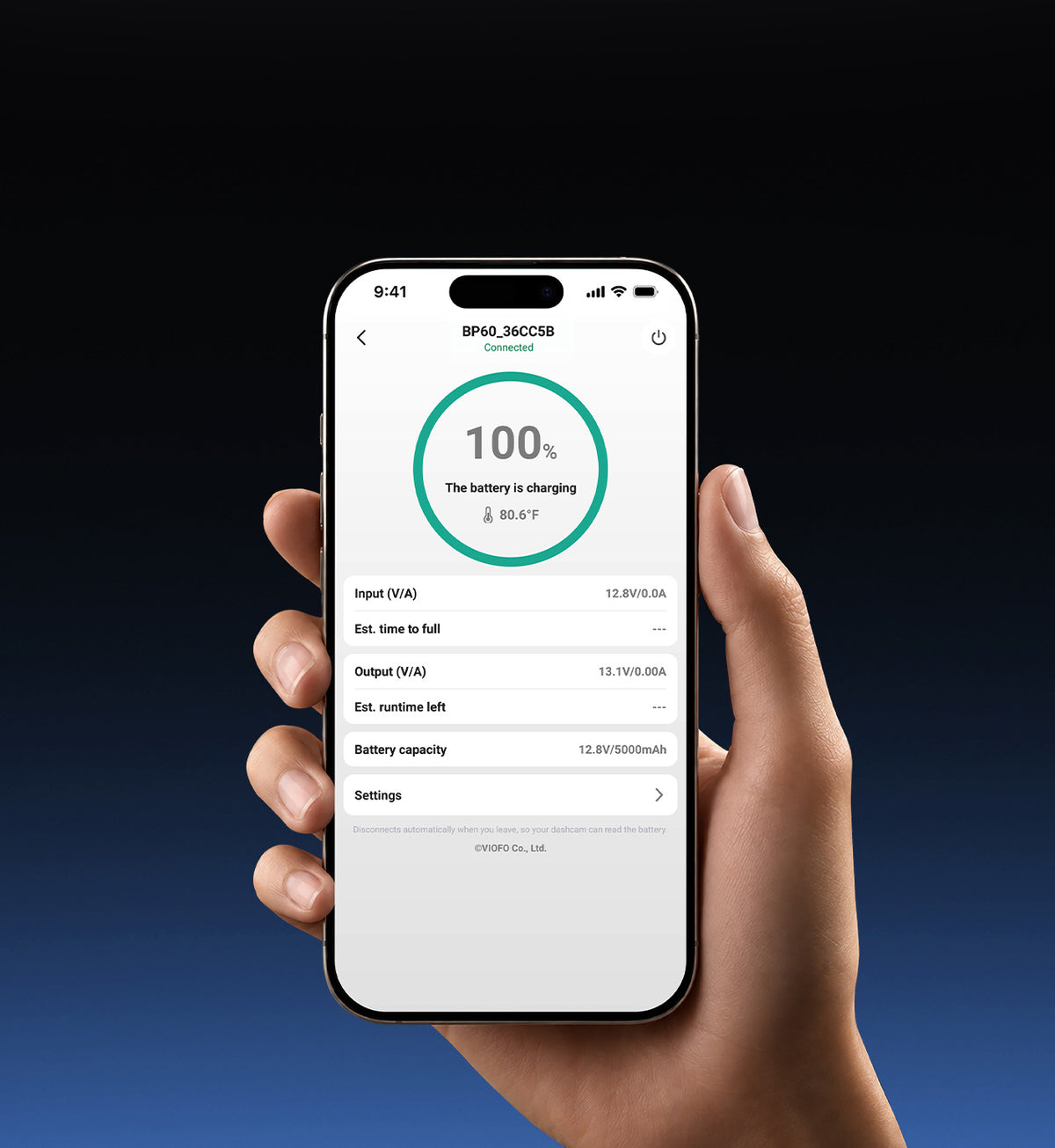 Hand holding a phone with the VIOFO app showing the BP60 at 100%